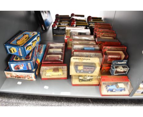 A shelf of Modern diecasts including Matchbox K138 Fire Rescue Set, K39 Fire Tender and K144 Road Maintenance and 38 Matchbox