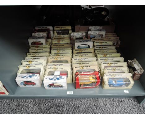 A shelf of Lledo Models of Yesteryear and similar diecasts, all boxed, approx 60