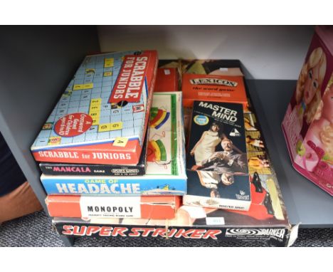 A collection of vintage games including Parker Super Striker, Peter Pan Headache, Mastermind, Scrabble etc