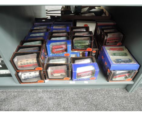 A shelf of EFE diecasts including De Luxe Buses and Wagons, Fishermans Friends and similar sets, all boxed approx 56