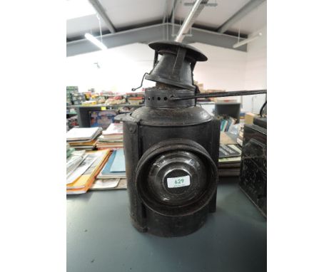 A LMS Railway Adlake Non Sweating Lamp having single bulls eye lens, height including handle 47cm