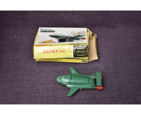 A Dinky diecast, 101 Thunderbird 2 push button undercarriage release detachable pod, with opening ramp door, containing Thund