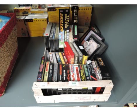 A box of vintage Amstrad, PC and similar cassette tape games including Shogun, Elite Firebird, Get Dexter, Antiriad etc