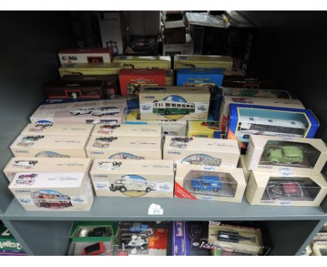 A shelf of Corgi diecasts including Classics, Super Heroes, The Times Classics, Whitbred etc, all boxed approx 53