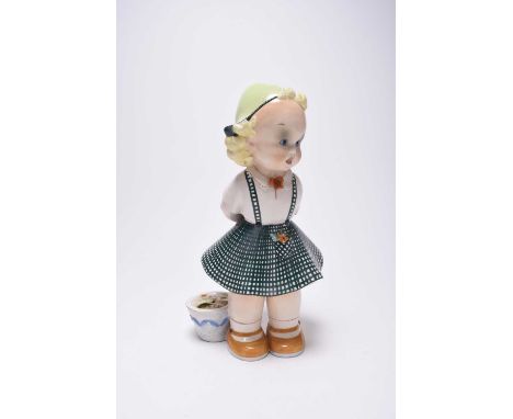 An Italian art pottery figure, La Freccia di Tarcisio Tosin, circa 1930-40, modelled as a characteristic young girl in a cheq