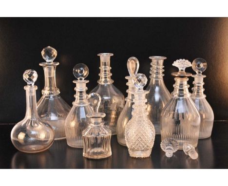 A selection of Regency and later glass decanters, comprising a near pair of triple ring neck decanters with Prussian slice an
