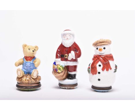 Three Halcyon Days enamel bonbonnieres; comprising Father Christmas, a snowman and a teddy bear, each contained with original