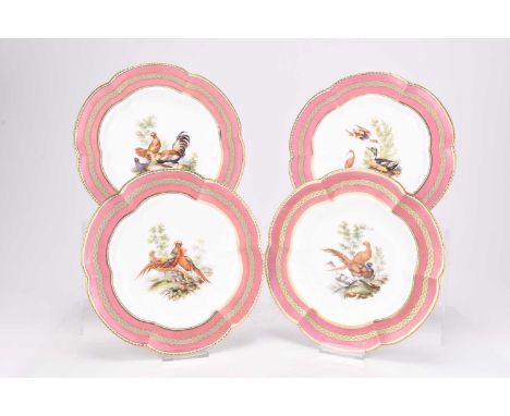 A set of four English dessert plates, circa 1870, probably Minton, centrally painted with chickens and game birds in wooded l