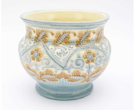 A Burmantofts faience jardiniere, circa 1890, shape 1927, decorated in polychrome, moulded in relief with scrolling flowers, 