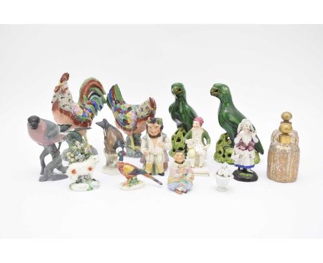 A group of models of birds, comprising a pair of green-glazed earthenware Chinese export parrots, 20th century, 19cm high; a 