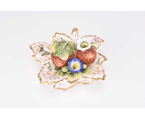 An English porcelain inkwell, circa 1840, of novelty form modelled as two large strawberries and flowers moulded on a base wi