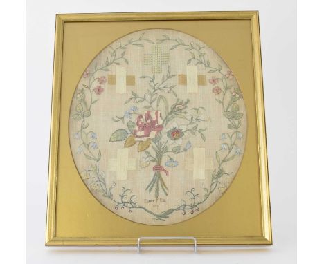 A George II needlework sampler, dated 1746By Esther Bix, of oval form and worked with a spray of roses, wildflowers and folia