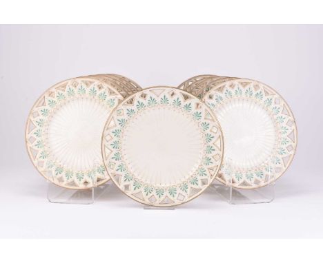 A set of eleven Irish Belleek 'Greek' dessert plates, Second Period, circa 1891-1926, of circular form with pierced detail to