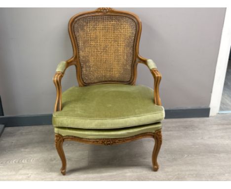 Vintage metal studded &amp; Bergere backed armchair, with green fabric &amp; heavily carved frame