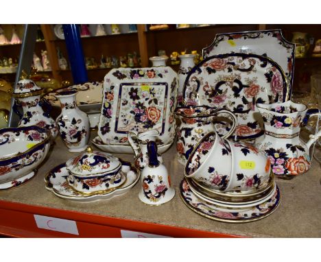 A COLLECTION OF MASON'S 'BLUE MANDALAY' PATTERN IRONSTONE  comprising two tea cups, three saucers, a pair of vases, height 20