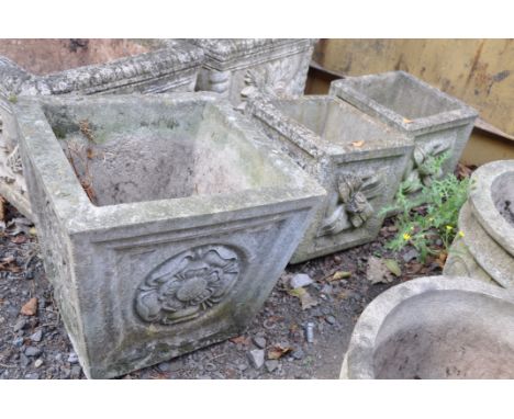 A PAIR OF SMALL COMPOSITE SQUARE GARDEN PLANTERS with foliate detail to each facet width and  depth 26cm height 31cm and a la