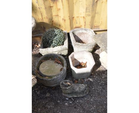 FOUR MODERN COMPOSITE GARDEN PLANTERS and a boot ornament, the largest planter being a baluster square planter with scrolled 