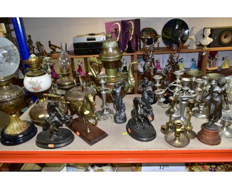 A QUANTITY OF METALWARES, CLOCKS AND CANDELABRA, comprising a brass oil lamp with foliate design brass reservoir, acid etched