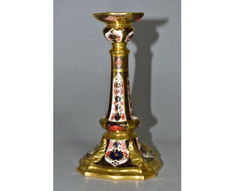 A ROYAL CROWN DERBY OLD IMARI 1128 SOLID GOLD BAND CASTLETON CANDLESTICK, heavily gilded with leaf detail to square base, red