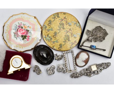 A SELECTION OF COSTUME JEWELLERY AND COMPACTS, to include a Victorian jet mourning brooch, a white metal shell cameo brooch d