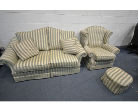 A STRIPPED GREEN AND GOLD LOUNGE SUITE, comprising a two seater settee, length 185cm x depth 104cm, a wing back armchair, and