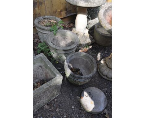 A PAIR OF COMPOSITE GARDEN PLANTERS , a similar planter and a plaque, the pair have foliate detail to sides  diameter 36cm he