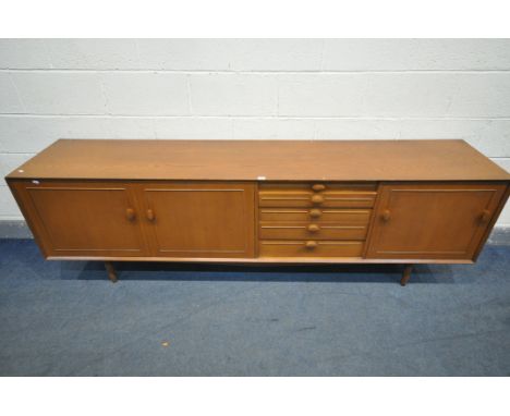 A MID CENTURY TEAK SIDEBOARD, with two cupboard doors, five graduated drawers, top drawer with cutlery dividers, and a fall f