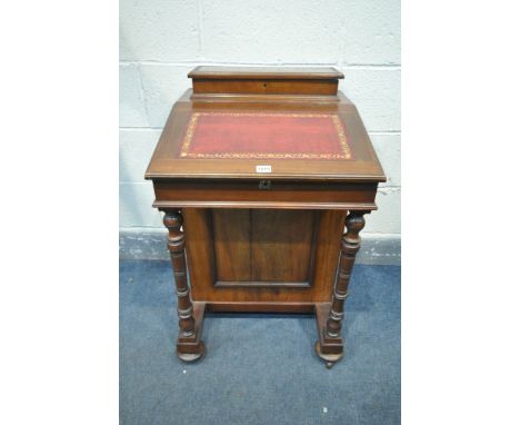 A 20TH CENTURY MAHOGANY DAVENPORT, with a raised back, red leather and gilt writing surface, on turned supports, four drawers