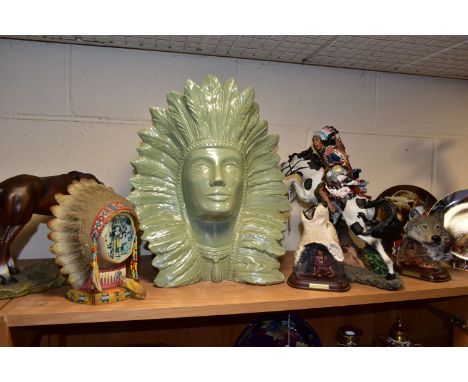 A GROUP OF NATIVE AMERICAN THEMED ORNAMENTS, eight pieces to include a large ceramic green lustre glazed bust of a Native Ame