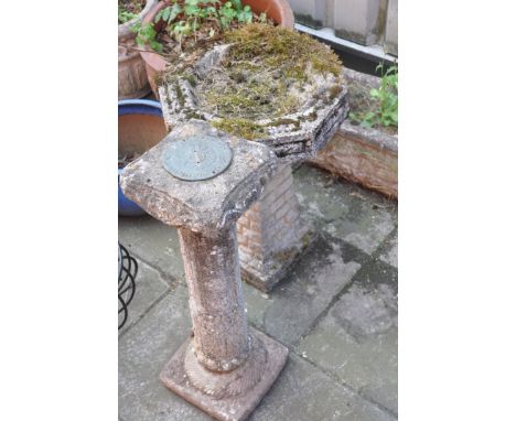 A COMPOSITE BIRD BATH width and depth of octagonal top 43cm, height 61cmand a Sun Dial height 72cm, (Condition:- good on both