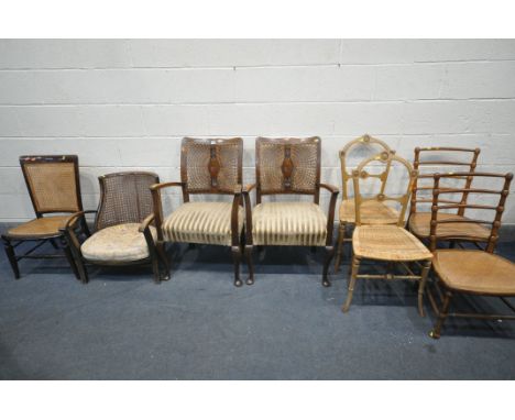 A SELECTION OF VARIOUS CHAIRS, to include a pair of oak armchairs, with cane back and stripped upholstery, a low armchair, a 