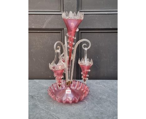 A Victorian cranberry glass epergne,&nbsp;51cm high.