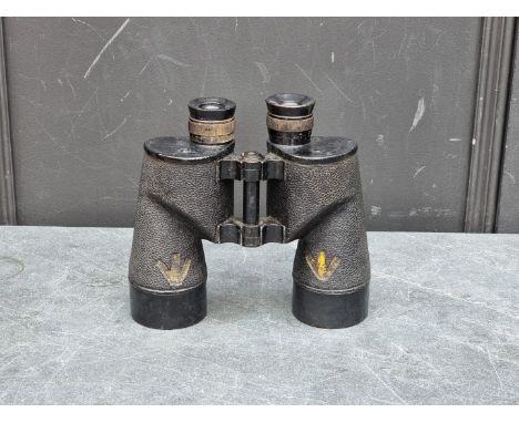 A pair of military 7x50 binoculars,&nbsp;with broad arrow marks, indistinctly inscribed.