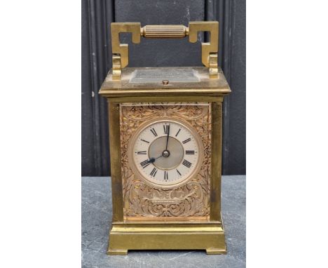 An old brass carriage clock, with silvered fretwork panels, striking on a gong, the movement signed 'E.M &amp; Co', height in