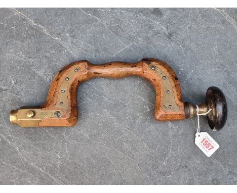 A brass mounted carpenter's brace,&nbsp;stamped 'W Marples &amp; Sons, Sheffield, Hibernia'.