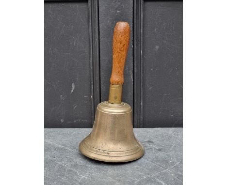 An old bronze hand bell,&nbsp;with clapper, 32cm high.