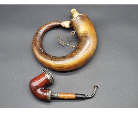 A late 19th century horn powder flask; together with a Continental metal mounted pipe. (2) 