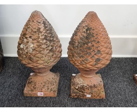 A pair of terracotta pinecone gate pier finials,&nbsp;48cm high.