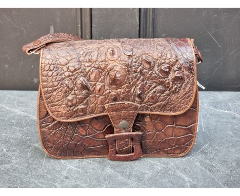 A vintage crocodile handbag. 