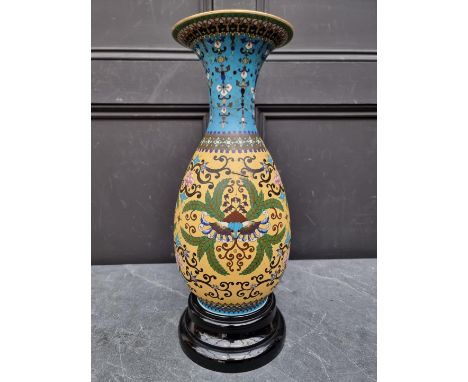 A Japanese porcelain vase, simulating cloisonne enamel, 39cm high, (restored), on opaque glass stand.