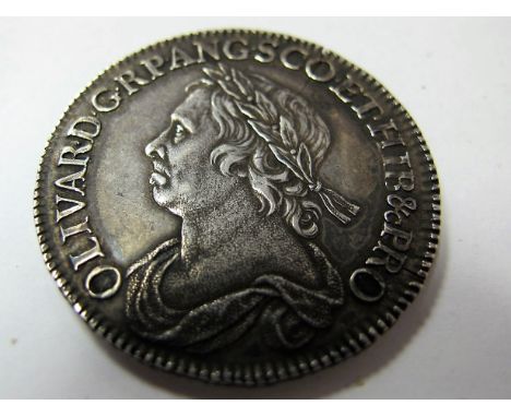 An Oliver Cromwell Halfcrown, 1658. A pleasing coin F/GF (but flan crack). Strong portrait.