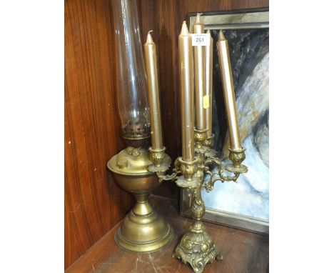 A VINTAGE BRASS OIL LAMP TOGETHER WITH A BRASS CANDELABRA