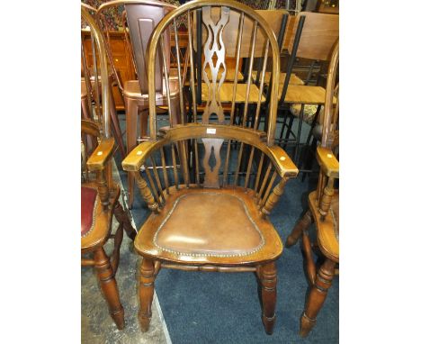 A VINTAGE WINDSOR STYLE ARMCHAIR WITH BROWN LEATHER SEAT AND SPINDLE BACK