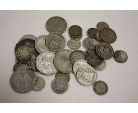 A BAG OF VINTAGE WHITE METAL WORLD COINS