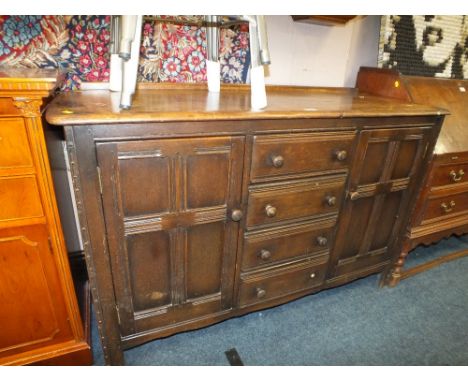 A VINTAGE OAK ERCOL STYLE SIDEBOARD W-144 CM A/F