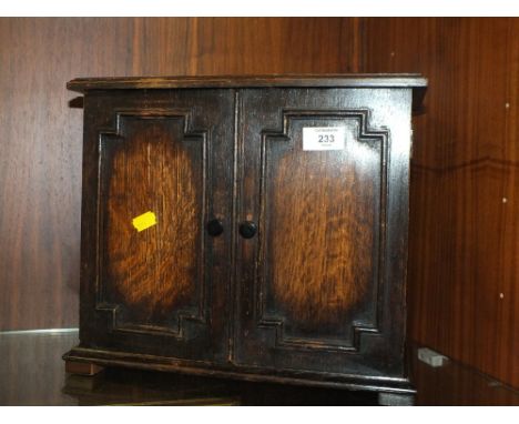A VINTAGE OAK JACOBEAN STYLE TABLETOP CUPBOARD 