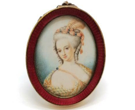 Antique hand painted portrait miniature of a lady with plumed feather hair decoration in a gilt metal &amp; enamel oval frame