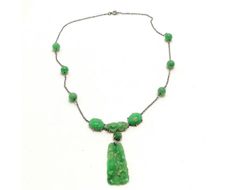 Chinese hand carved jade pendant on a jade stone set necklet in unmarked white gold - 34cm long with 4.5cm pendant drop &amp;