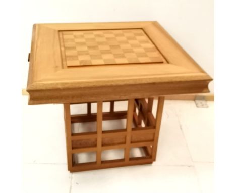 Interesting David Trubridge American black oak Chess table, with glass top, and the turned chess pieces contained in drawers,