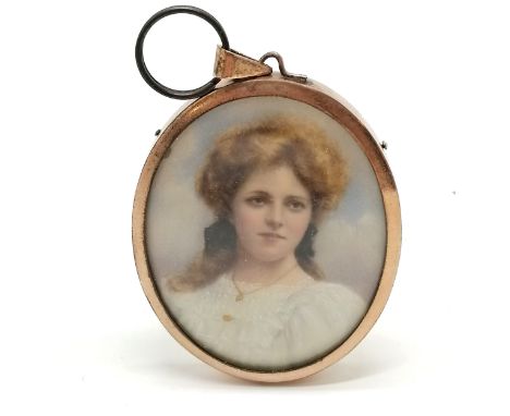 Antique hand painted portrait miniature of a lady in a gilt metal oval frame - 6cm drop 